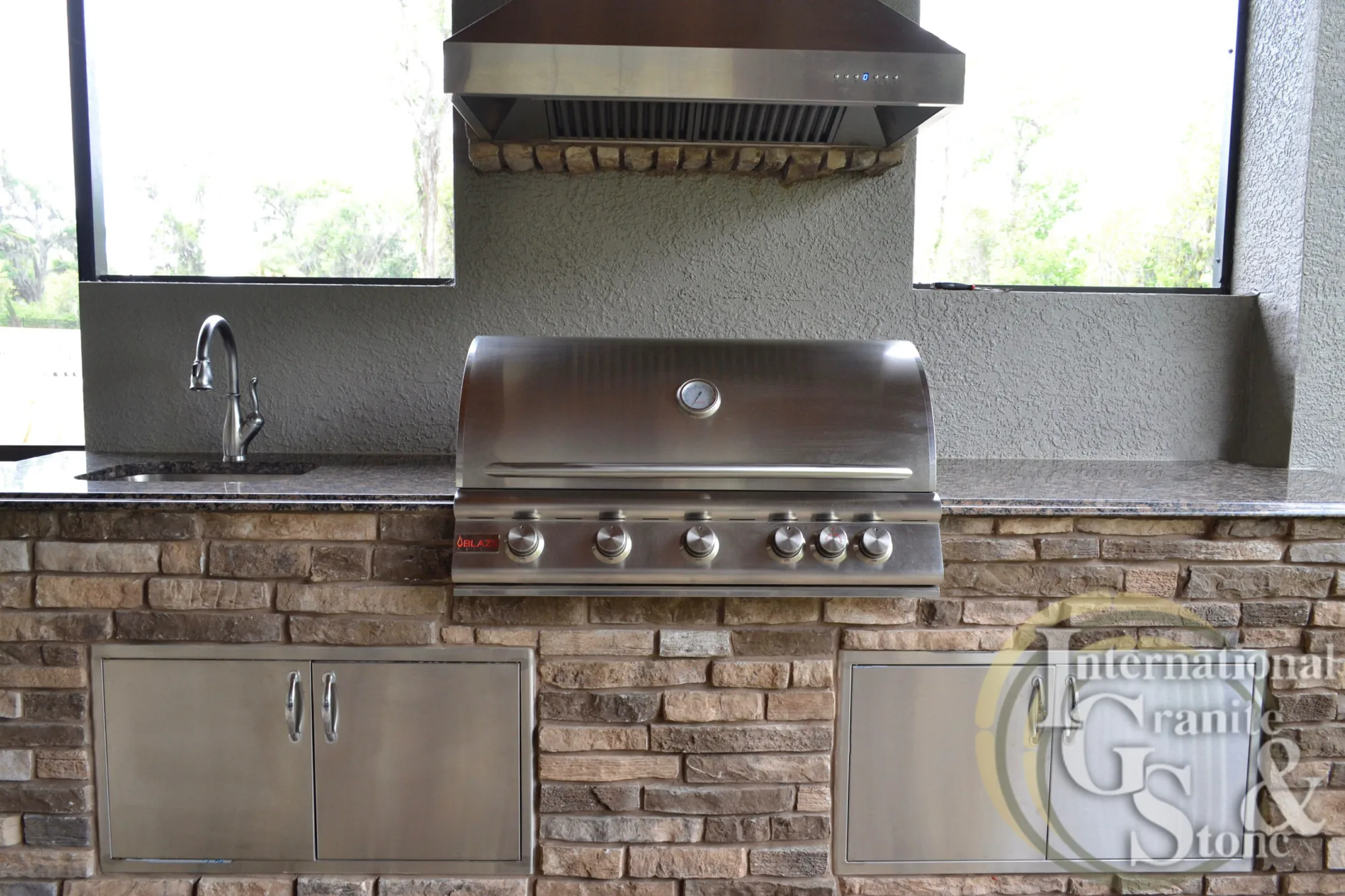 Baltic Brown Granite Outdoor Kitchen Countertop with Blaze Grill and Fake Brick Fascia