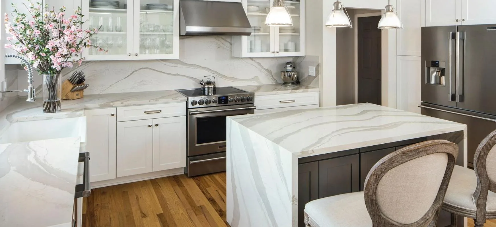 Cambria Quartz Brittanicca Warm Kitchen with Full Height Quartz Backsplash and a Waterfall Panel Island