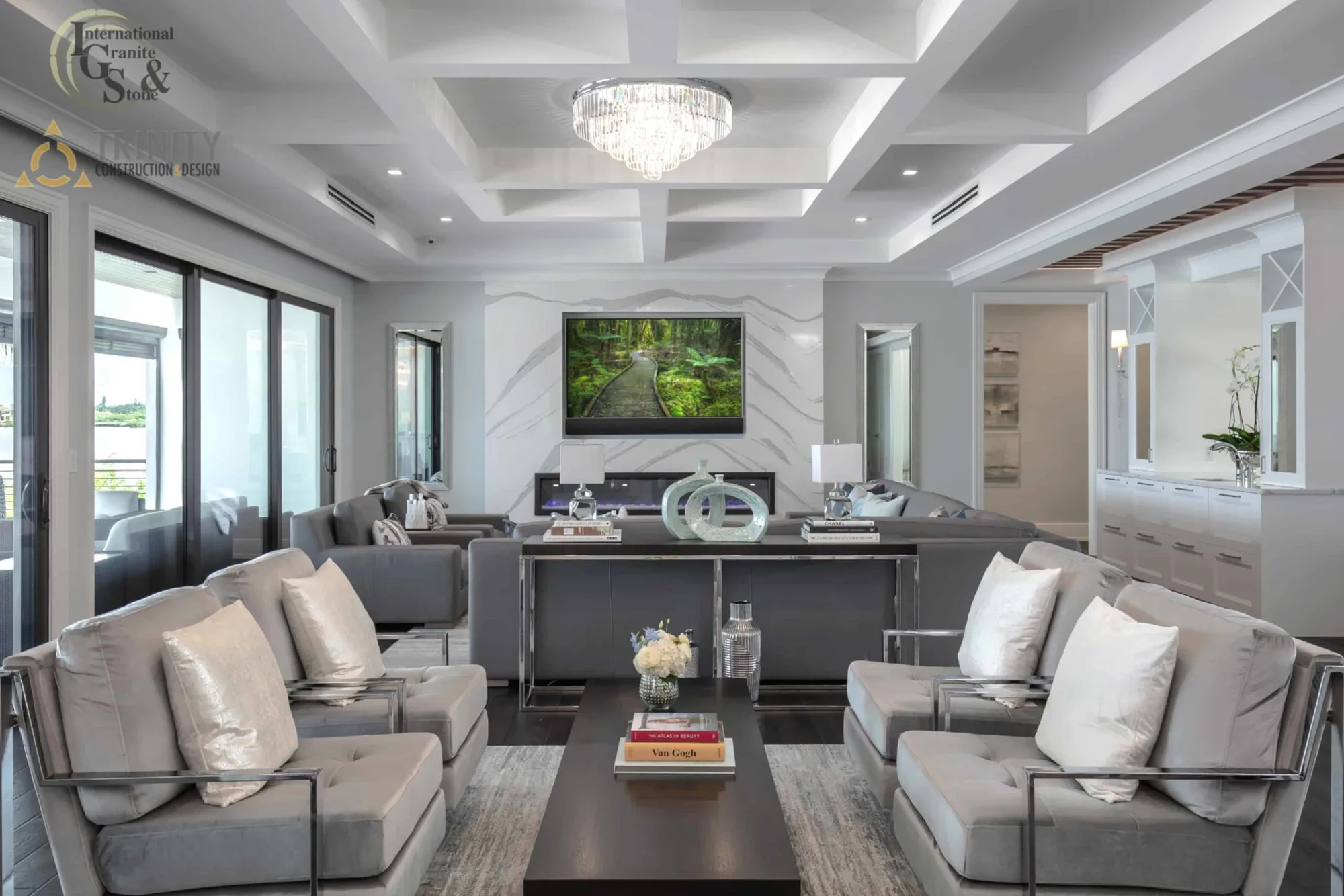 Cambria Brittanicca Kitchen Countertops Bathroom Countertops White and Gray Quartz Countertops White Cabinets Kitchen Island marble looking quartz International Guild of Surfaces Trinity Construction and Design Collaboration gray furniture gray flooring white tile white backsplash