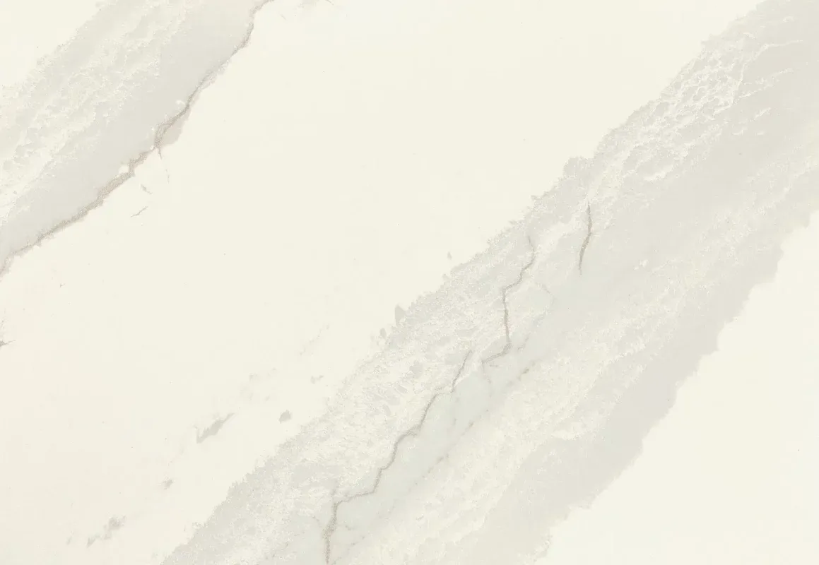 A close-up view of Cambria Inverness Swansea Quartz, showcasing its tonal white, marbled design with intricate debossed Inverness veins. Available in both high gloss and Cambria Matte finishes