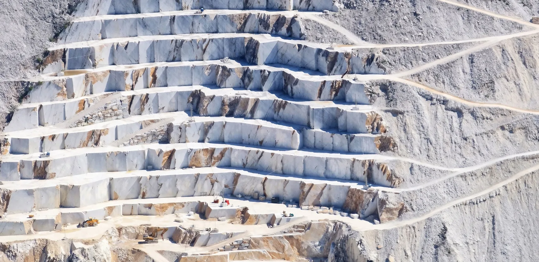The Calacatta Marble Quarries in Italy's Apuan Alps embody the convergence of natural beauty and artistic expression. Renowned for producing luxurious Calacatta marble, these quarries showcase its distinctive appearance and rarity. Amidst the towering peaks, skilled extraction reveals a canvas of geological art, each slab telling a story spanning millennia. The marble serves as inspiration for architectural masterpieces and artworks worldwide. A blend of tradition and innovation, these quarries echo with nature's beauty and human dedication, symbolizing opulence and taste. They celebrate the intricate interplay between Earth's treasures and human creativity, encapsulating elegance and enduring artistic connection.