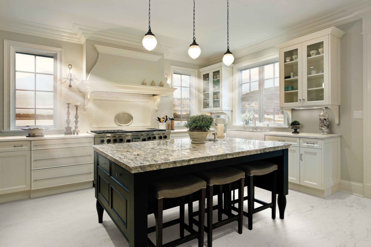 Wentwood Cambria Quartz Kitchen Countertops with Black and White Wood Cabinets, Bar Stools, and Stainless Steel