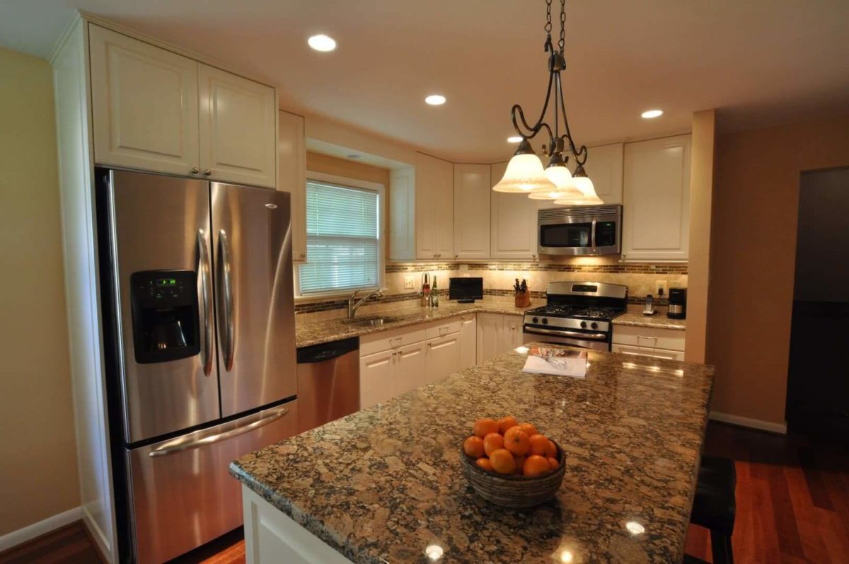 Giallo Fiorito Granite Kitchen with White Cabinets and Stainless Steel