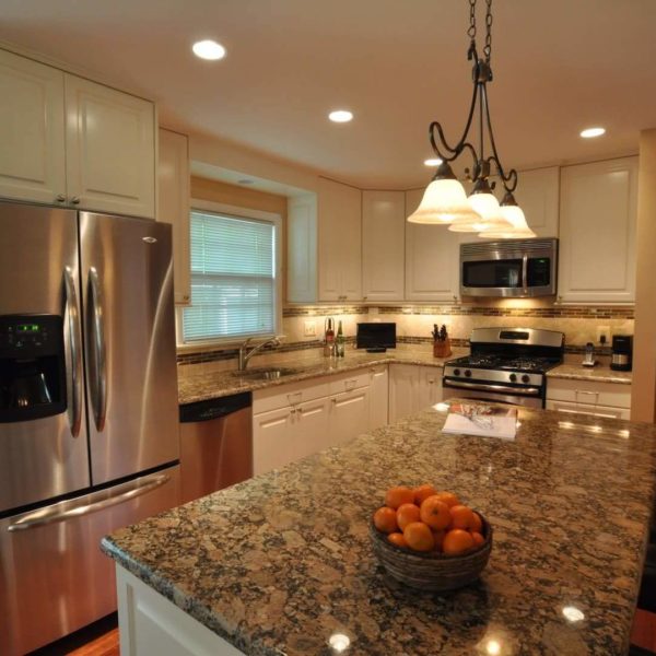 Giallo Fiorito Granite Kitchen with White Cabinets and Stainless Steel