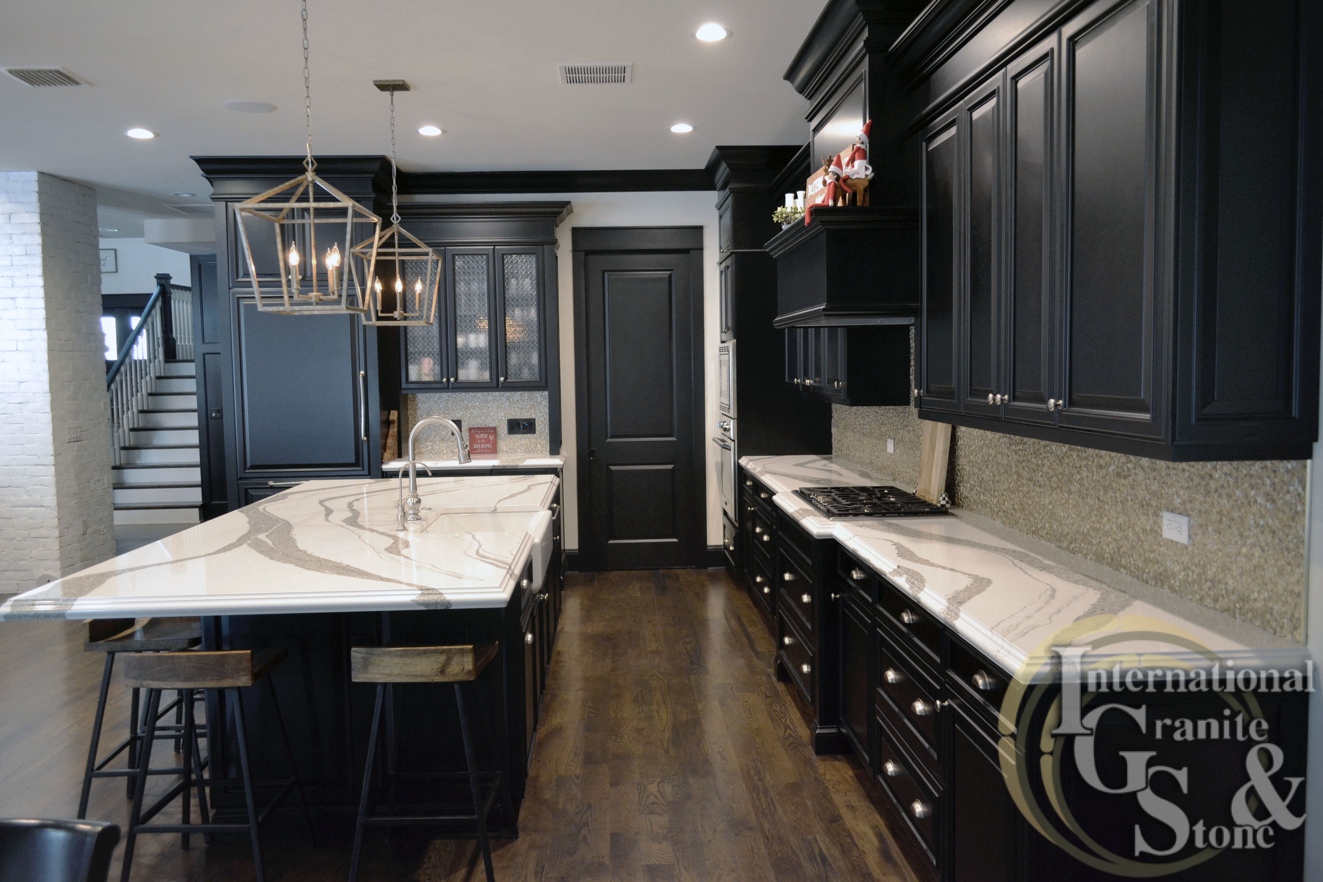 Dark Cabinet Kitchen with Cambria Quartz Striking Veining and White Background