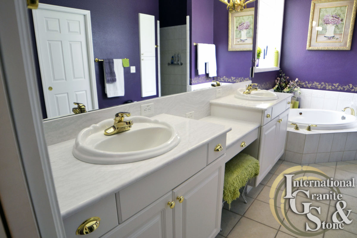 Double Sink Cambria Delgatie Countertops in Bathroom with White Cabinets