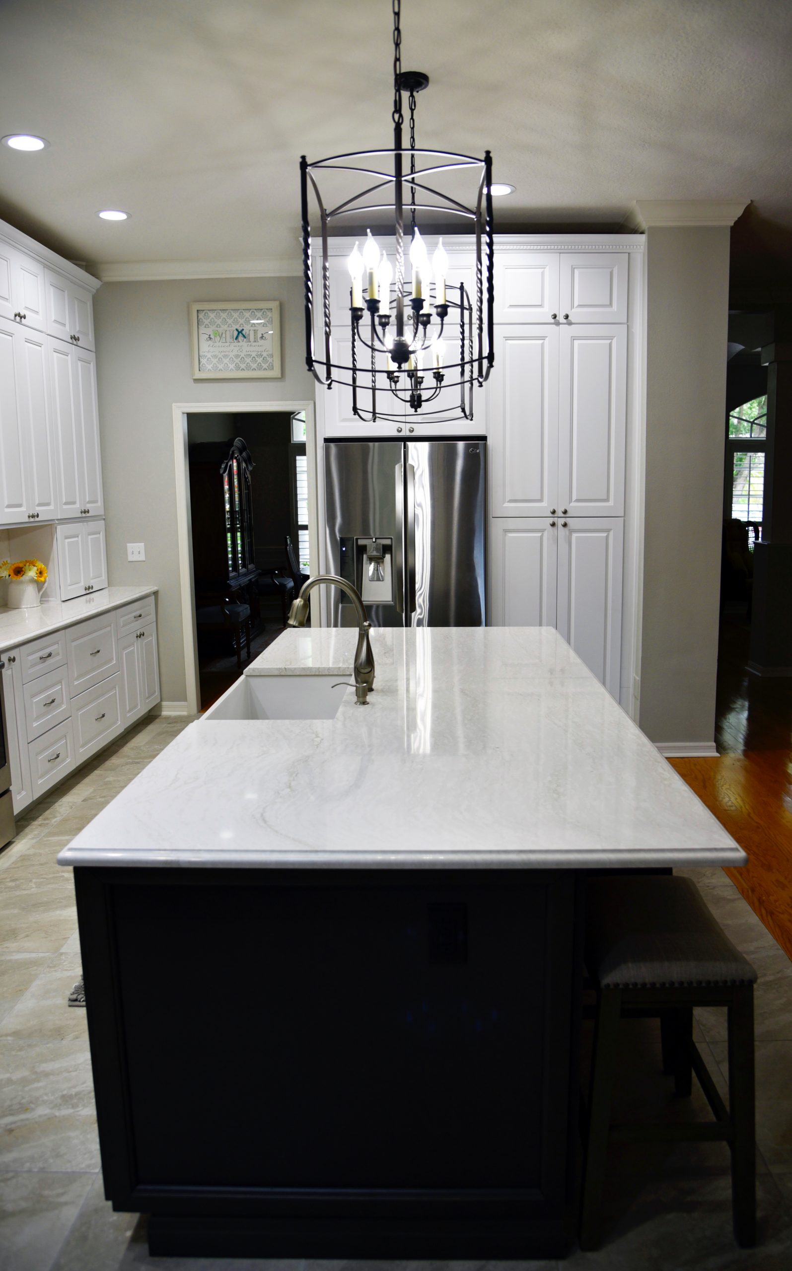 Roberts Ironsbridge Cambria Quartz Kitchen Countertops in West Palm Beach Florida White Cabinets Black Cabinets Island Stainless Steel Appliances White Cast Iron Farmhouse Sink Caged Pendant Lights