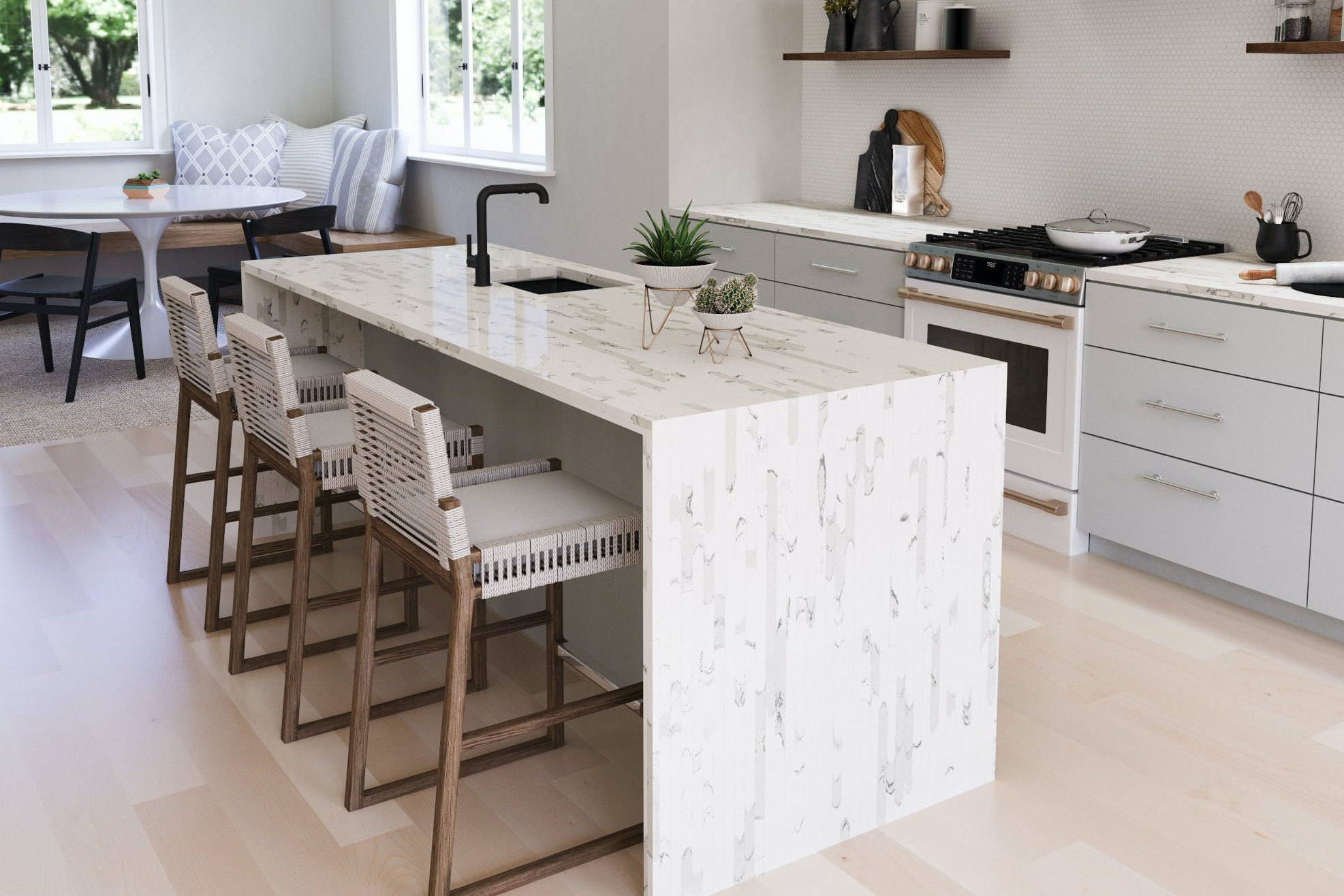 Brittanicca Block Cambria Quartz Kitchen Countertops with White Wood Cabinets, Wood Floors, and Bar Stools