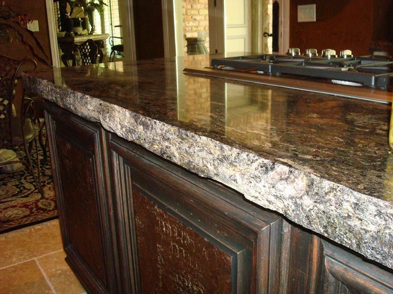 Chiseled Edge on Granite Countertop with Dark Brown Wood Cabinets