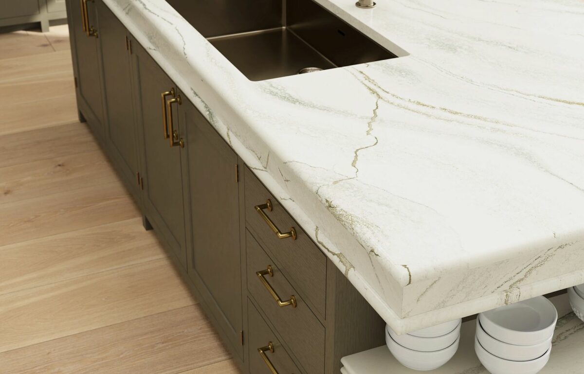 Close-up view of Cambria Inverness Everleigh Quartz surface, showcasing its intricate blend of cool gray and warm, sand-honey tones with debossed Inverness veins kitchen countertops